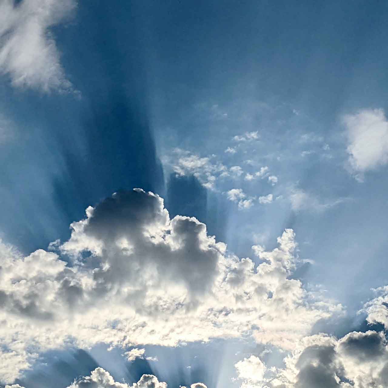 Sun behind cloud in sky